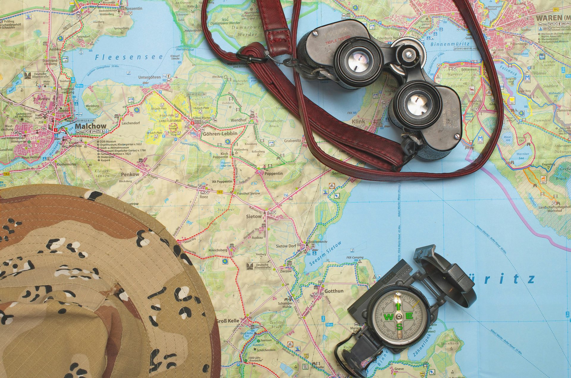 black binoculars on map